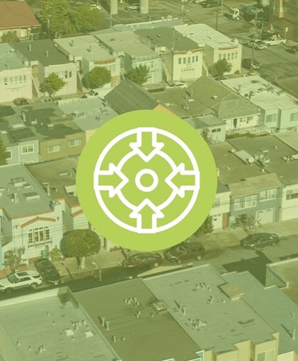 A green circle with arrows in center of a city